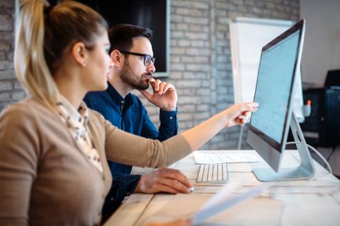 Two tech professionals studying for agile certifications